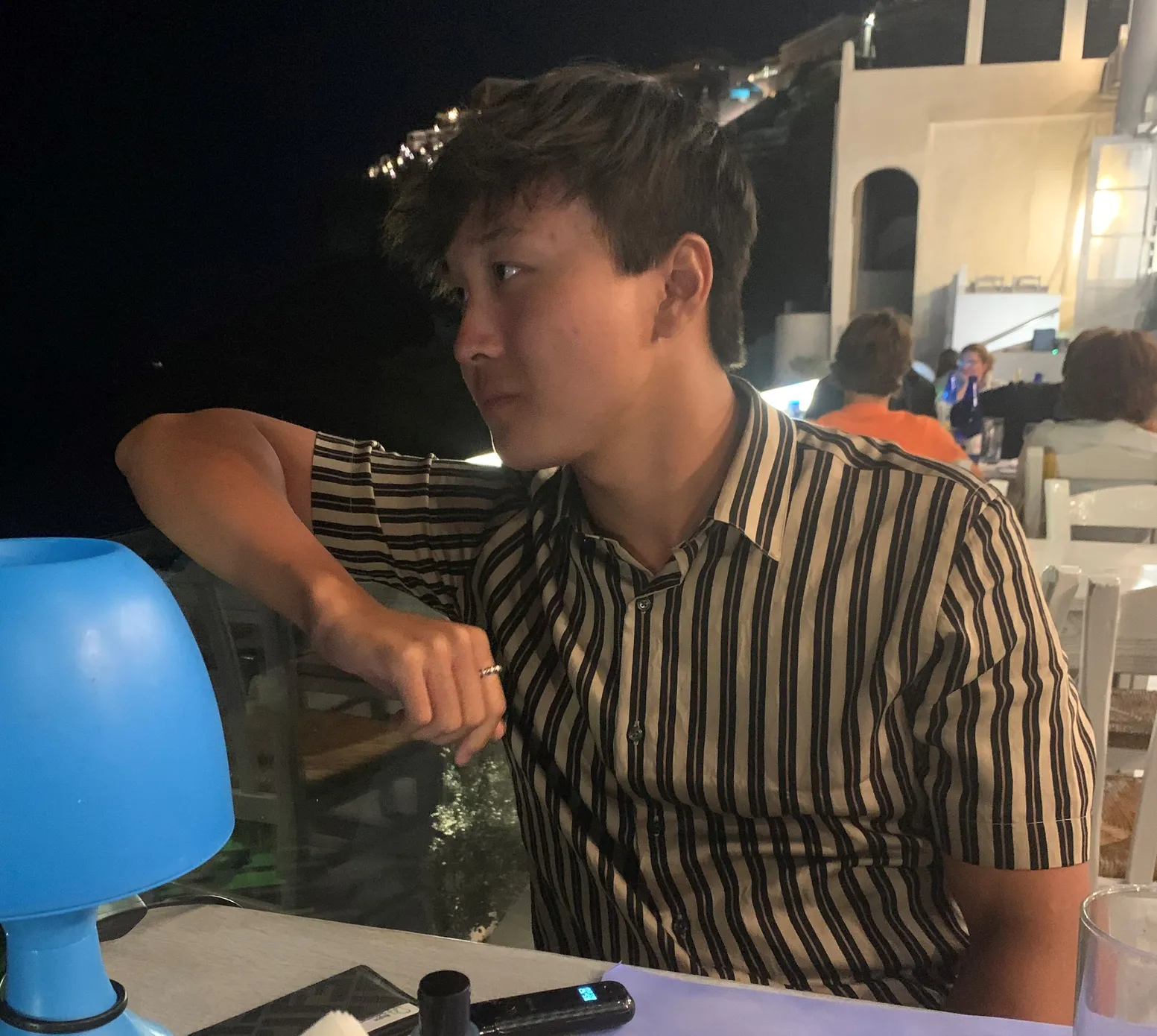 Phillip Lam at a resturant looking over the fence